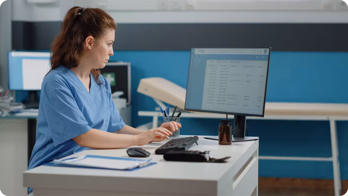 nurse typing computer keyboard consultation1 ezgif.com apng to avif converter